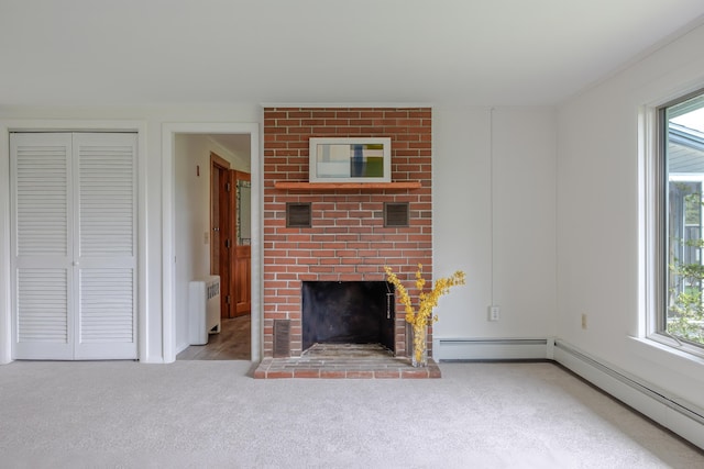 4 Seawall Point Ln, Southwest Harbor, ME 04679 - unfurnished living room featuring a baseboard heating unit, radiator, a fireplace, carpet floors, and ornamental molding