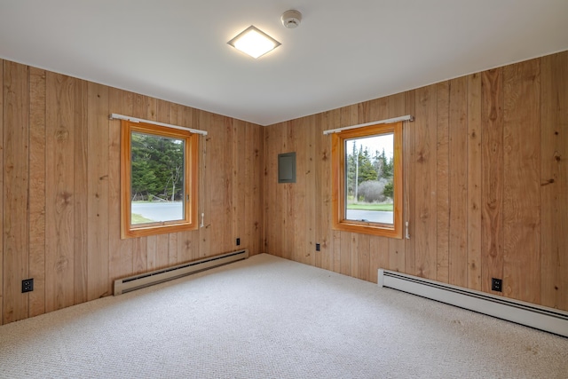 4 Seawall Point Ln, Southwest Harbor, ME 04679 - spare room with a baseboard radiator, baseboard heating, carpet, healthy amount of natural light, and wooden walls