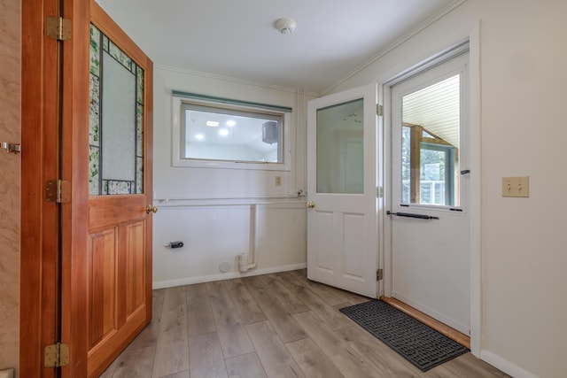 4 Seawall Point Ln, Southwest Harbor, ME 04679 - doorway featuring ornamental molding and light wood finished floors