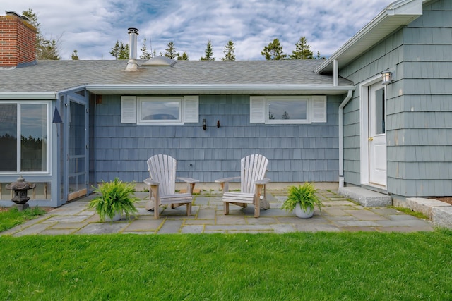 4 Seawall Point Ln, Southwest Harbor, ME 04679 - back of property featuring a patio area, a shingled roof, and a yard