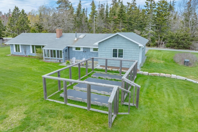 4 Seawall Point Ln, Southwest Harbor, ME 04679 - back of property with a chimney, a lawn, and roof with shingles
