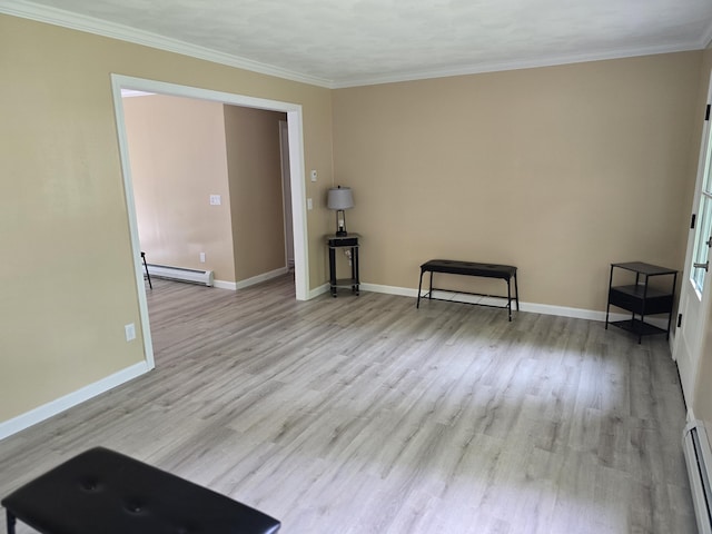 60 Rolling Rdg, Jay, ME 04239 - unfurnished room with baseboard heating, wood finished floors, baseboards, and crown molding