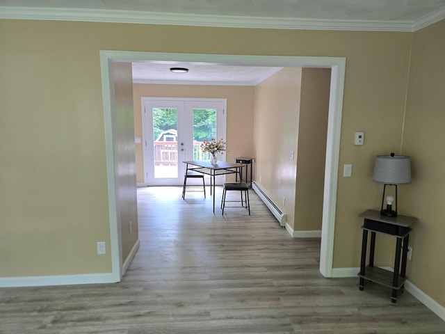 60 Rolling Rdg, Jay, ME 04239 - hallway featuring baseboard heating, crown molding, french doors, baseboards, and wood finished floors