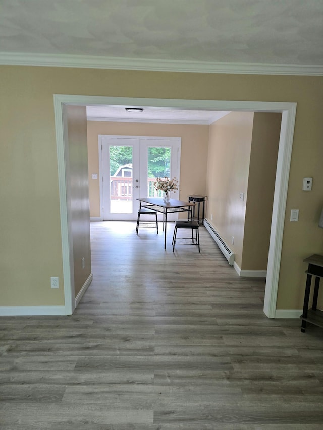 60 Rolling Rdg, Jay, ME 04239 - corridor featuring a baseboard heating unit, french doors, baseboards, wood finished floors, and ornamental molding