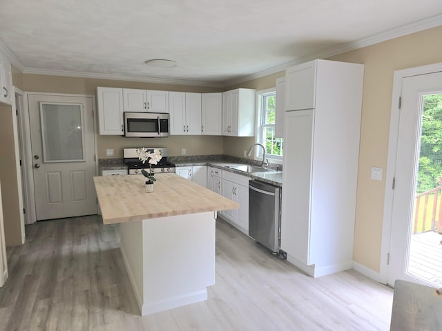 60 Rolling Rdg, Jay, ME 04239 - kitchen featuring stainless steel appliances, butcher block counters, a sink, a kitchen island, and white cabinets