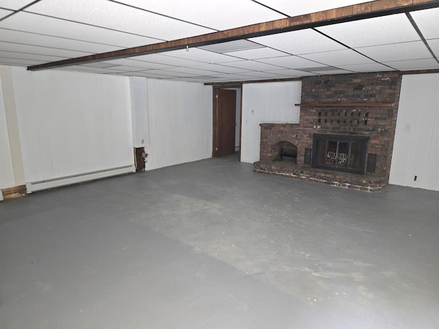 60 Rolling Rdg, Jay, ME 04239 - unfurnished living room featuring baseboard heating, finished concrete floors, and a brick fireplace