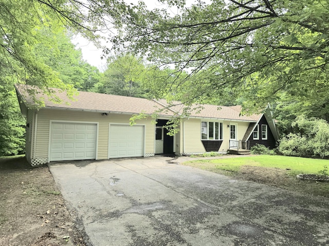 60 Rolling Rdg, Jay, ME 04239 - view of front facade featuring asphalt driveway, an attached garage, and roof with shingles
