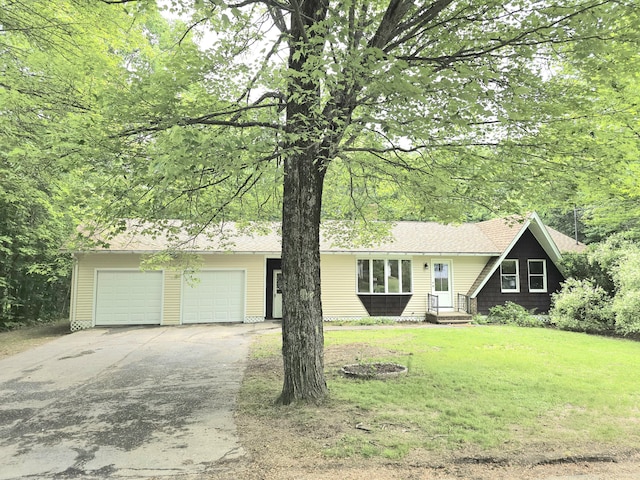 60 Rolling Rdg, Jay, ME 04239 - view of front of property with driveway, a garage, and a front lawn