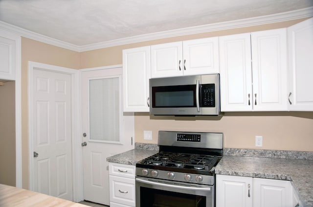 60 Rolling Rdg, Jay, ME 04239 - kitchen with stainless steel appliances, white cabinets, light countertops, and ornamental molding