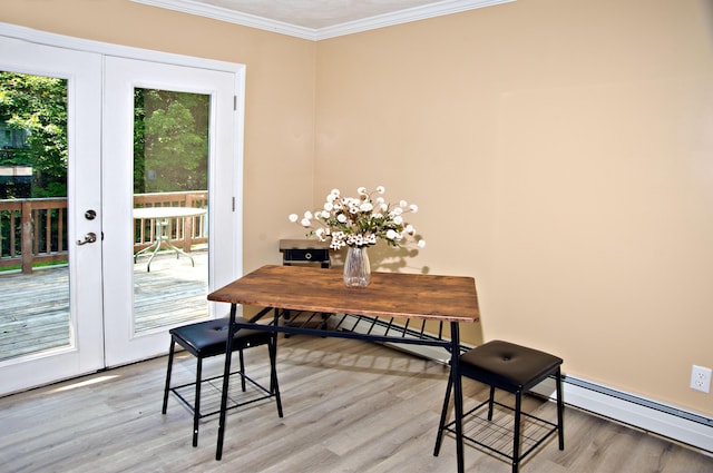 60 Rolling Rdg, Jay, ME 04239 - dining area with a baseboard radiator, light wood-style flooring, crown molding, and french doors