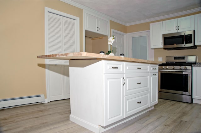 60 Rolling Rdg, Jay, ME 04239 - kitchen with appliances with stainless steel finishes, light wood-style floors, white cabinets, crown molding, and a baseboard heating unit
