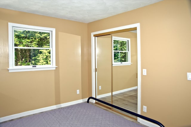 60 Rolling Rdg, Jay, ME 04239 - unfurnished bedroom featuring baseboards and a closet