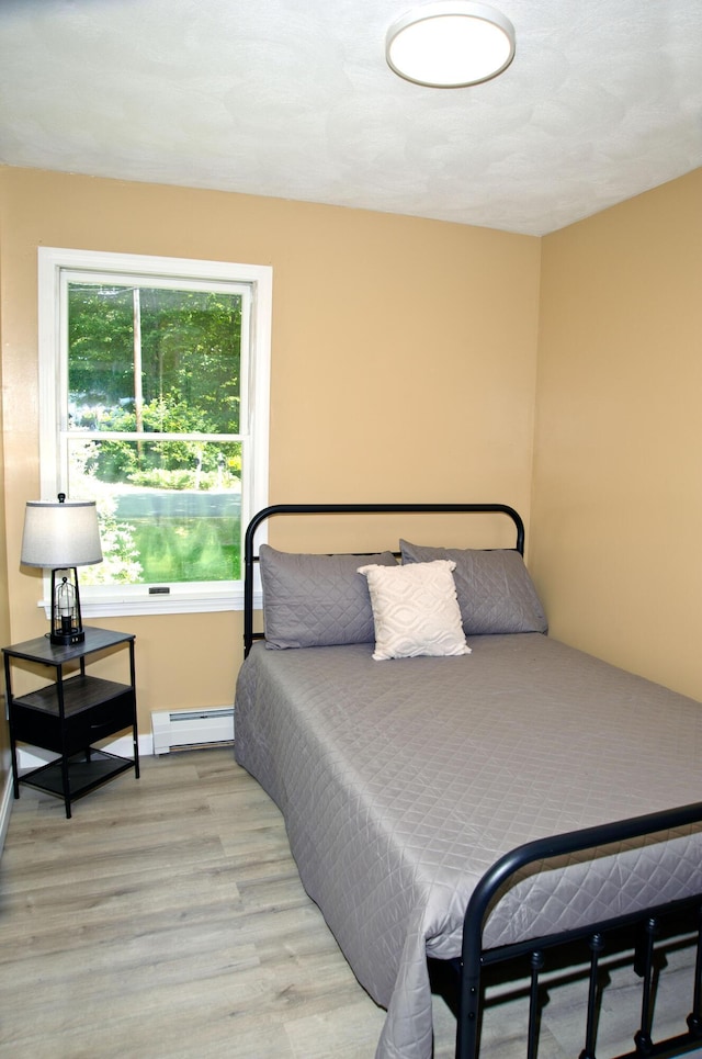 60 Rolling Rdg, Jay, ME 04239 - bedroom with a baseboard radiator and light wood-style flooring
