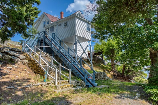 16 Tilton Ln, Southport, ME 04576 - rear view of house featuring stairway and a chimney