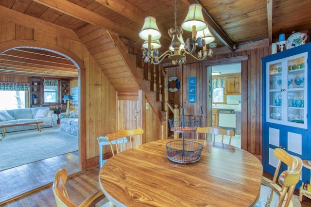 16 Tilton Ln, Southport, ME 04576 - dining space with wooden walls, wooden ceiling with exposed beams, stairway, healthy amount of natural light, and wood finished floors