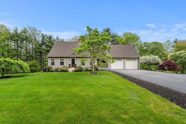 27 Wilmer Chase Rd, North Berwick, ME 03906 - view of front of property with driveway, an attached garage, a front lawn, a chimney, and roof with shingles