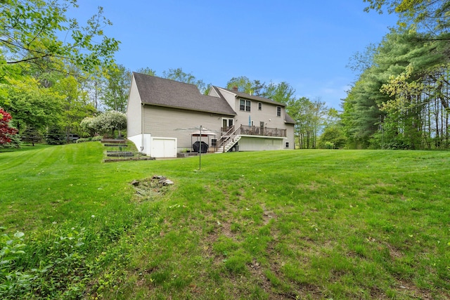 27 Wilmer Chase Rd, North Berwick, ME 03906 - back of house with stairway, a deck, and a lawn