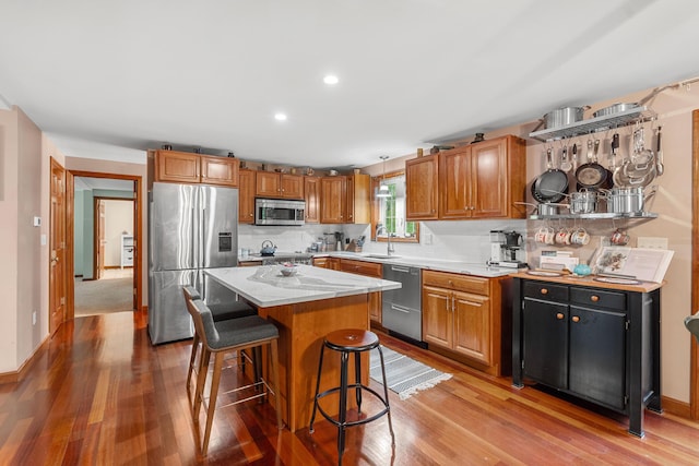 27 Wilmer Chase Rd, North Berwick, ME 03906 - kitchen featuring appliances with stainless steel finishes, a sink, light wood-type flooring, a center island, and recessed lighting