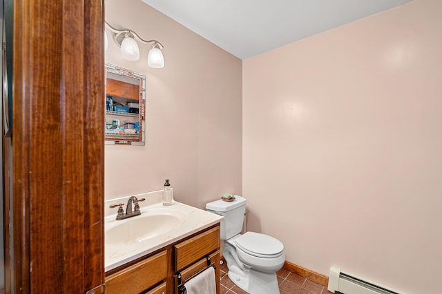 27 Wilmer Chase Rd, North Berwick, ME 03906 - half bathroom with a baseboard radiator, tile patterned flooring, toilet, vanity, and baseboards