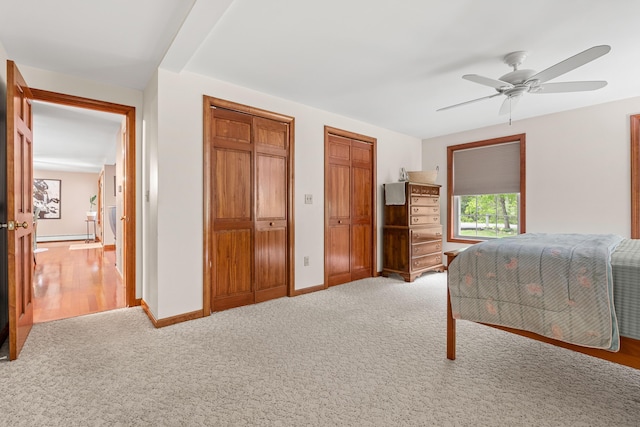 27 Wilmer Chase Rd, North Berwick, ME 03906 - bedroom with two closets, light carpet, baseboards, and a ceiling fan