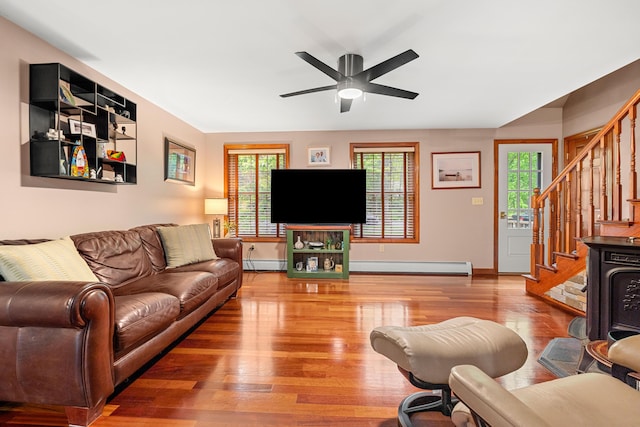 27 Wilmer Chase Rd, North Berwick, ME 03906 - living room featuring a baseboard radiator, stairs, and healthy amount of natural light
