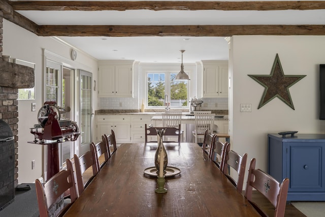 52 Lester B Orcutt Blvd, Biddeford, ME 04006 - dining space featuring beamed ceiling