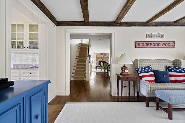52 Lester B Orcutt Blvd, Biddeford, ME 04006 - living area featuring dark wood finished floors, beam ceiling, and baseboards