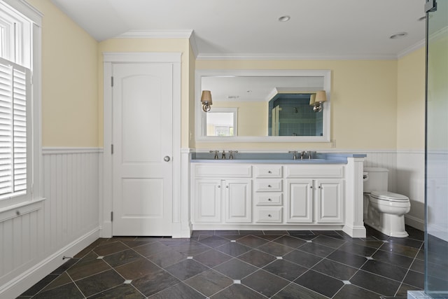 52 Lester B Orcutt Blvd, Biddeford, ME 04006 - full bathroom with double vanity, wainscoting, toilet, a shower, and ornamental molding