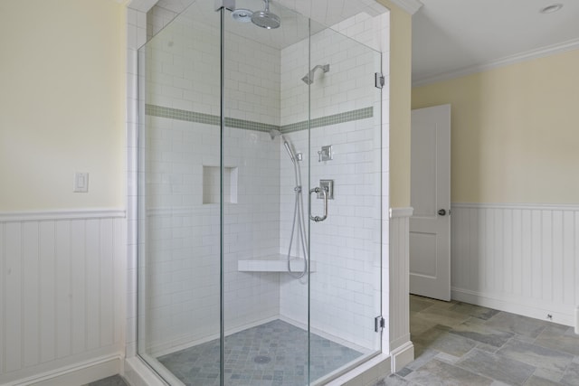 52 Lester B Orcutt Blvd, Biddeford, ME 04006 - bathroom with a shower stall, wainscoting, ornamental molding, and stone finish floors