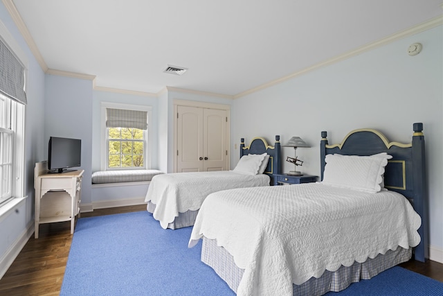 52 Lester B Orcutt Blvd, Biddeford, ME 04006 - bedroom featuring wood finished floors, crown molding, baseboards, and a closet