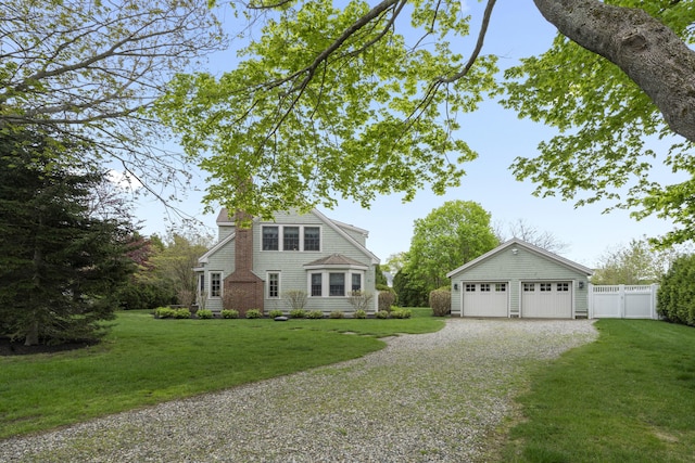52 Lester B Orcutt Blvd, Biddeford, ME 04006 - shingle-style home with a detached garage and gravel driveway