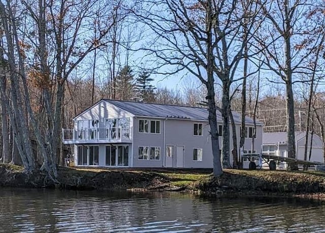 5 N Vigue Shore Rd, Albion, ME 04910 - rear view of property featuring a balcony, a water view, and metal roof