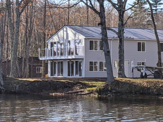 5 N Vigue Shore Rd, Albion, ME 04910 - rear view of property featuring a balcony, metal roof, and a water view