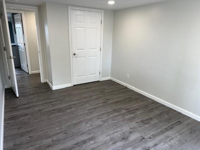 5 N Vigue Shore Rd, Albion, ME 04910 - unfurnished bedroom featuring baseboards, dark wood-type flooring, and recessed lighting