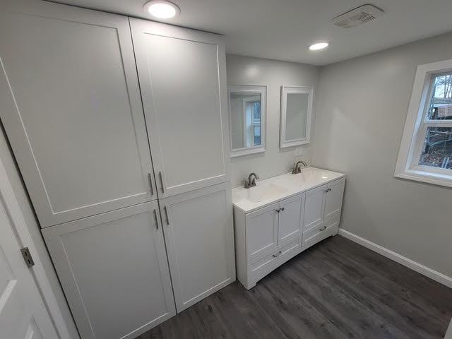 5 N Vigue Shore Rd, Albion, ME 04910 - full bath with wood finished floors, baseboards, and double vanity