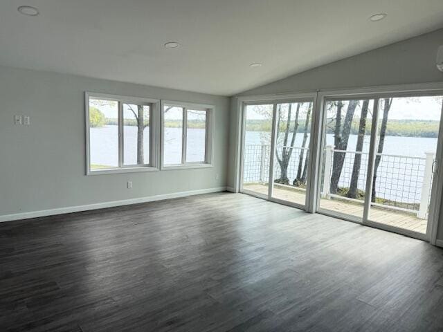 5 N Vigue Shore Rd, Albion, ME 04910 - spare room with vaulted ceiling, a water view, dark wood-type flooring, and baseboards