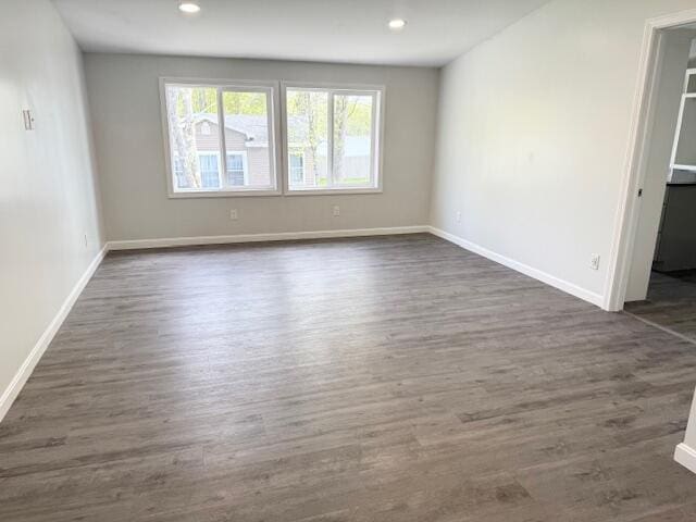 5 N Vigue Shore Rd, Albion, ME 04910 - empty room featuring dark wood-type flooring, baseboards, and recessed lighting