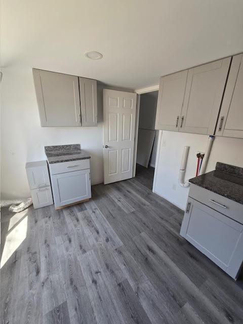 5 N Vigue Shore Rd, Albion, ME 04910 - kitchen featuring dark wood finished floors and dark countertops
