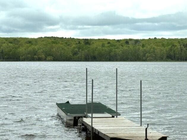 5 N Vigue Shore Rd, Albion, ME 04910 - dock area featuring a water view and a wooded view