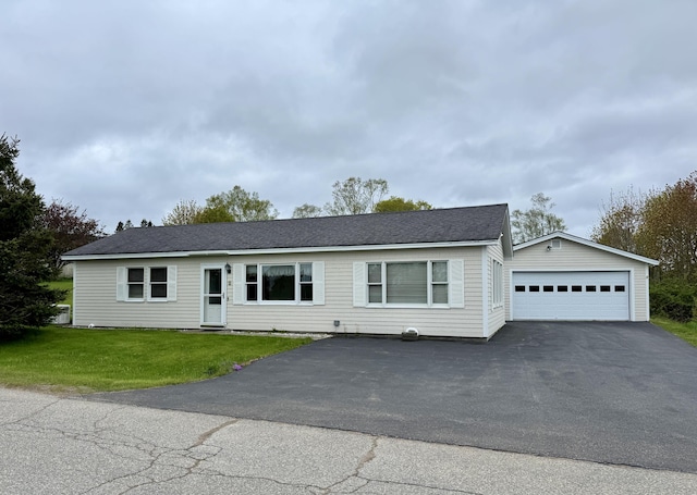 2 Cemetery Rd, Eastport, ME 04631 - view of front of property with a garage, an outdoor structure, a front yard, and driveway