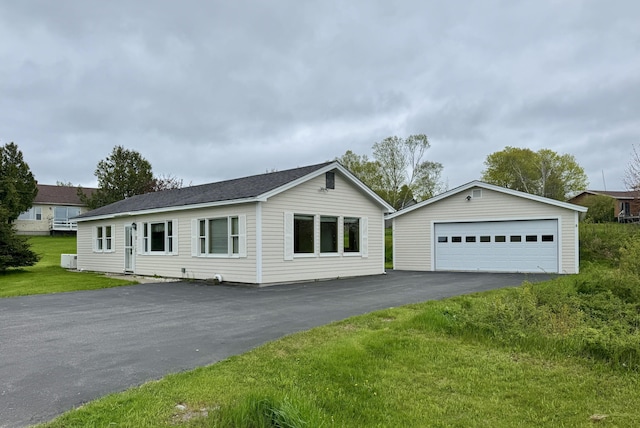 2 Cemetery Rd, Eastport, ME 04631 - view of front of property featuring an outdoor structure, a detached garage, and a front yard