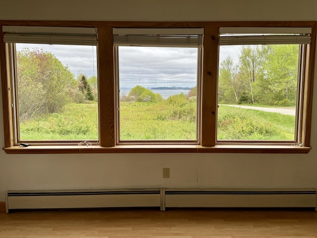 2 Cemetery Rd, Eastport, ME 04631 - unfurnished room featuring baseboard heating and wood finished floors
