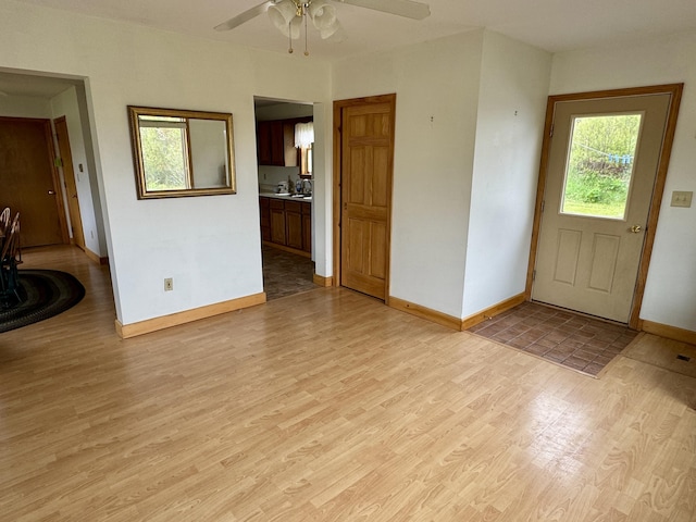 2 Cemetery Rd, Eastport, ME 04631 - entryway with baseboards, light wood finished floors, and ceiling fan
