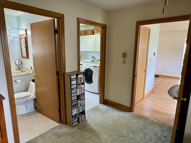 2 Cemetery Rd, Eastport, ME 04631 - corridor with washer / dryer and light carpet