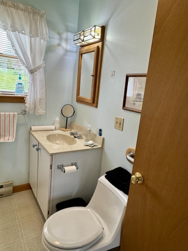 2 Cemetery Rd, Eastport, ME 04631 - half bath with vanity, toilet, and baseboards