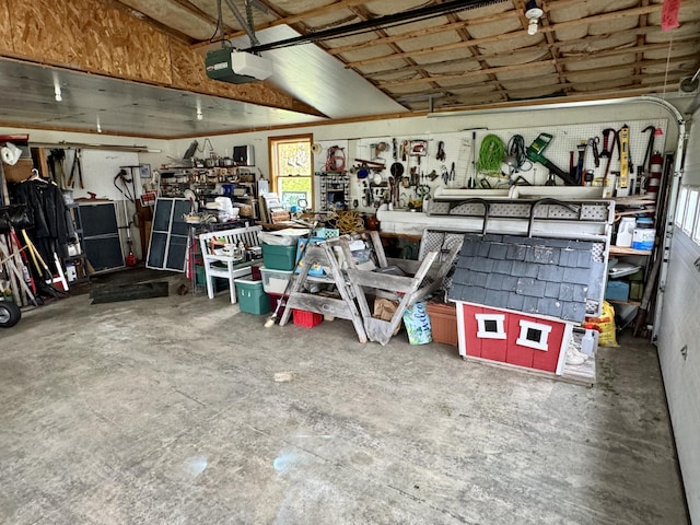 2 Cemetery Rd, Eastport, ME 04631 - garage featuring a garage door opener and a workshop area
