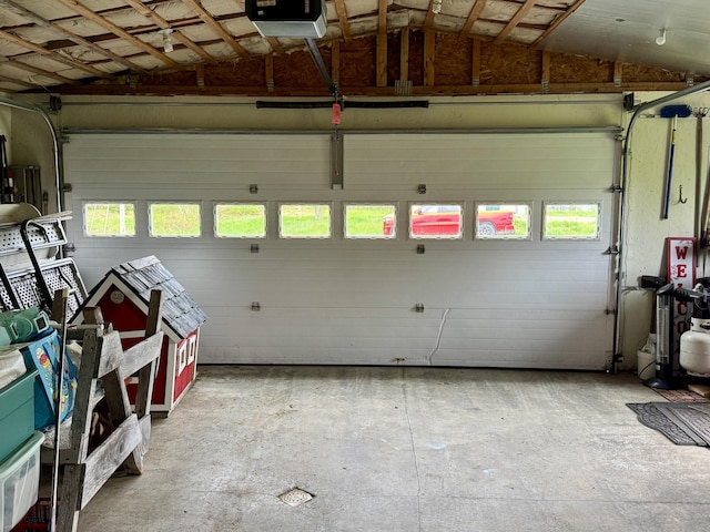 2 Cemetery Rd, Eastport, ME 04631 - garage featuring a garage door opener