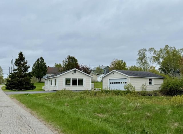 2 Cemetery Rd, Eastport, ME 04631 - view of property exterior with a detached garage and an outdoor structure