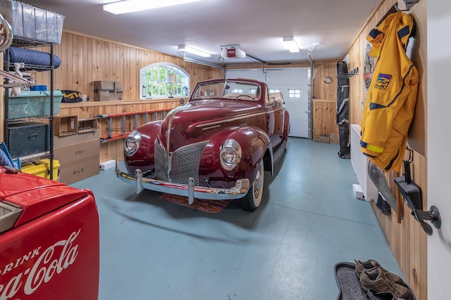 361 Cape Rd, Raymond, ME 04071 - garage with wooden walls and a garage door opener