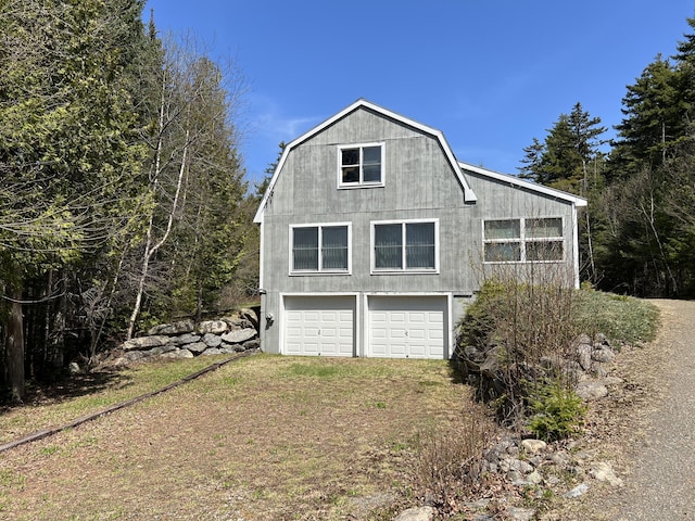 640 Bald Mountain Rd, Rangeley, ME 04970 - view of side of property featuring a gambrel roof and driveway